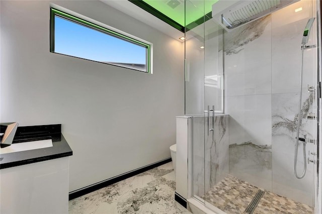 6526 Simone Shores Cir, Apollo Beach, FL 33572 - bathroom with a marble finish shower, toilet, marble finish floors, and vanity