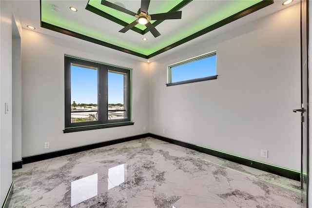 6526 Simone Shores Cir, Apollo Beach, FL 33572 - unfurnished room with baseboards, ceiling fan, light marble finish flooring, and recessed lighting