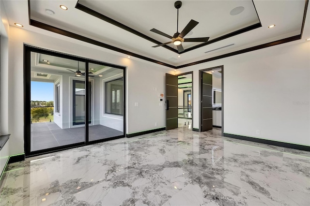 6526 Simone Shores Cir, Apollo Beach, FL 33572 - unfurnished room featuring a tray ceiling, a ceiling fan, crown molding, marble tiled floors, and baseboards