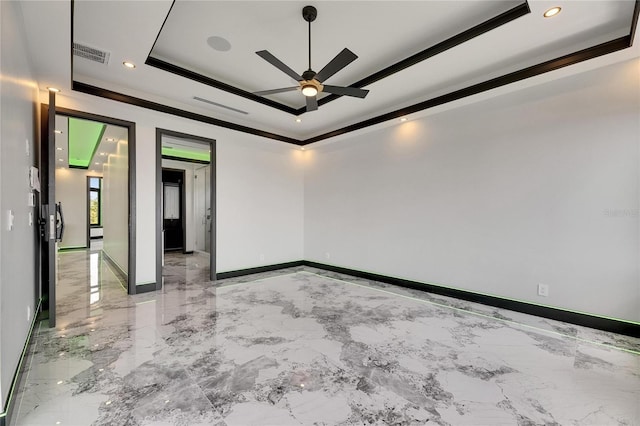 6526 Simone Shores Cir, Apollo Beach, FL 33572 - empty room with a raised ceiling, a ceiling fan, ornamental molding, light marble finish floors, and recessed lighting