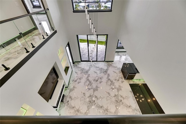 6526 Simone Shores Cir, Apollo Beach, FL 33572 - unfurnished living room with a high ceiling and marble tiled flooring