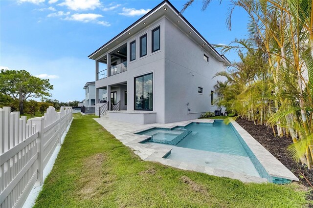 6526 Simone Shores Cir, Apollo Beach, FL 33572 - rear view of property with a balcony, stucco siding, and a pool with connected hot tub