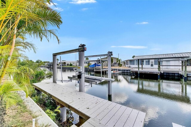 6526 Simone Shores Cir, Apollo Beach, FL 33572 - dock area with boat lift and a water view