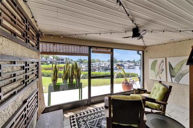 644 Yardarm Dr Unit 22, Apollo Beach, FL 33572 - sunroom / solarium with a water view and a ceiling fan