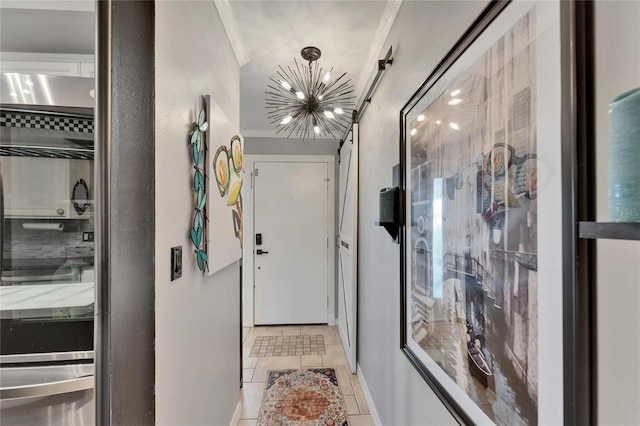 644 Yardarm Dr Unit 22, Apollo Beach, FL 33572 - corridor with a chandelier, light tile patterned floors, and baseboards