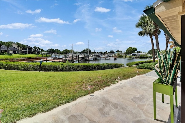 644 Yardarm Dr Unit 22, Apollo Beach, FL 33572 - view of grassy yard featuring a water view and a patio area