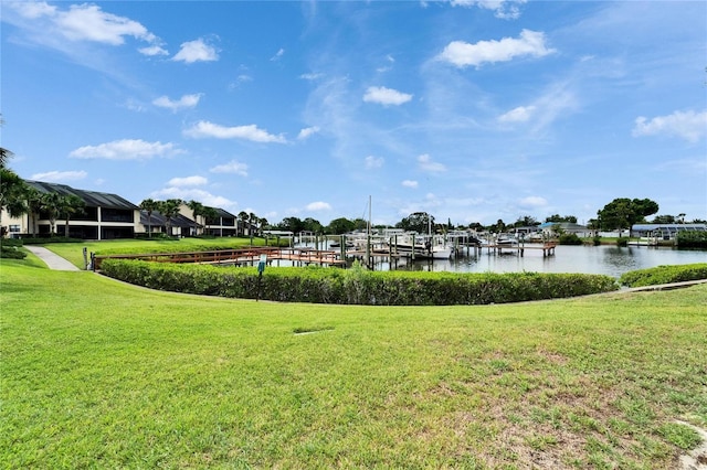 644 Yardarm Dr Unit 22, Apollo Beach, FL 33572 - dock featuring a water view and a lawn