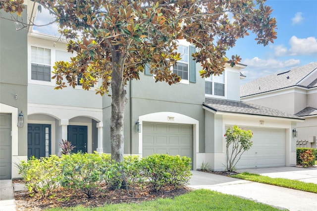 4910 Chatham Gate Drive Dr, Riverview, FL 33578 - multi unit property with stucco siding, driveway, a shingled roof, and a garage