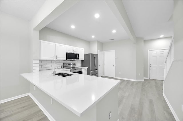 4910 Chatham Gate Drive Dr, Riverview, FL 33578 - kitchen featuring stainless steel appliances, a sink, light wood-style floors, light countertops, and tasteful backsplash