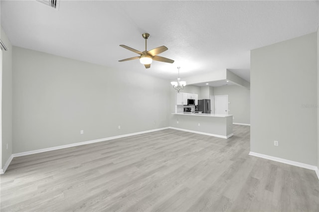 4910 Chatham Gate Drive Dr, Riverview, FL 33578 - unfurnished living room with a chandelier, baseboards, a ceiling fan, and light wood finished floors