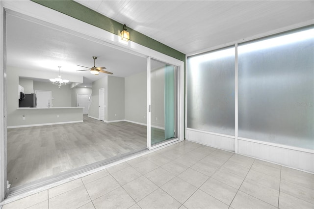 4910 Chatham Gate Drive Dr, Riverview, FL 33578 - spare room featuring a chandelier, ceiling fan, and tile patterned flooring