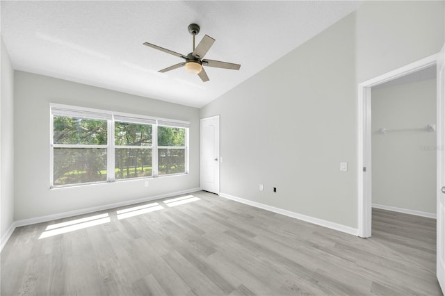 4910 Chatham Gate Drive Dr, Riverview, FL 33578 - unfurnished bedroom featuring vaulted ceiling, wood finished floors, a closet, baseboards, and a ceiling fan