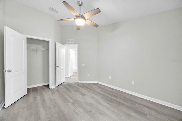 4910 Chatham Gate Drive Dr, Riverview, FL 33578 - unfurnished bedroom featuring wood finished floors, a closet, baseboards, a ceiling fan, and vaulted ceiling