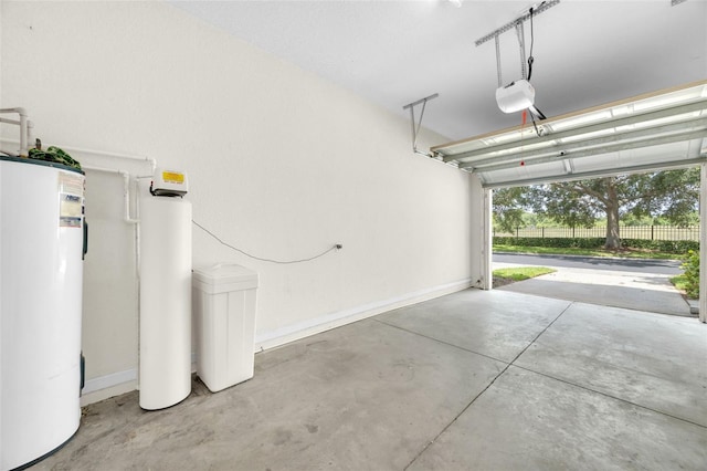 4910 Chatham Gate Drive Dr, Riverview, FL 33578 - garage with water heater, baseboards, and a garage door opener
