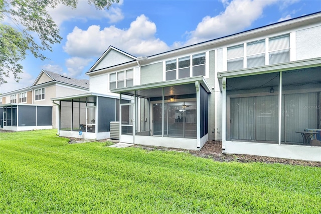 4910 Chatham Gate Drive Dr, Riverview, FL 33578 - back of house with a sunroom and a lawn