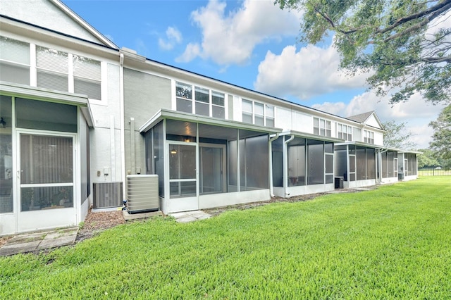 4910 Chatham Gate Drive Dr, Riverview, FL 33578 - back of property with a sunroom, a yard, central AC, and stucco siding