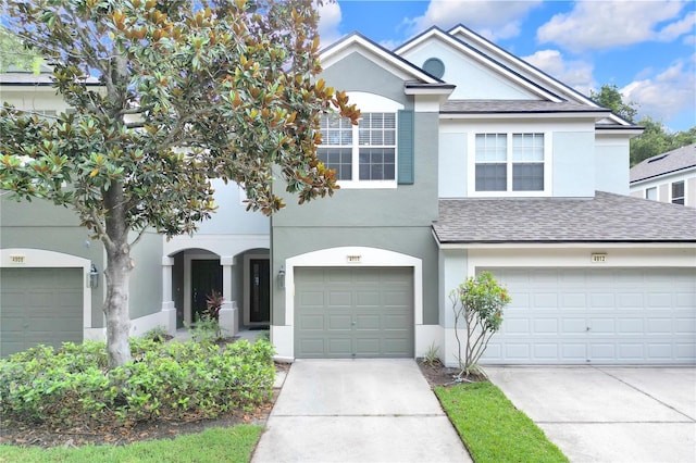 4910 Chatham Gate Drive Dr, Riverview, FL 33578 - view of front of house with stucco siding, a shingled roof, concrete driveway, and a garage