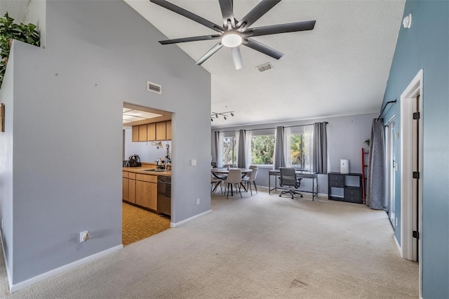 5540 Applegate Dr, Spring Hill, FL 34606 - living room featuring light carpet, baseboards, ceiling fan, and high vaulted ceiling