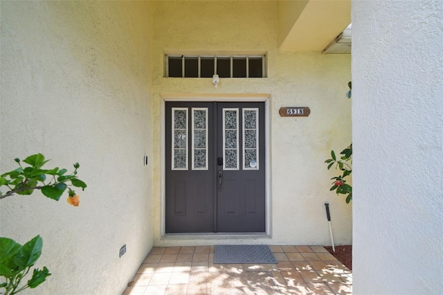6918 Potomac Cir, Riverview, FL 33578 - doorway to property featuring stucco siding and french doors
