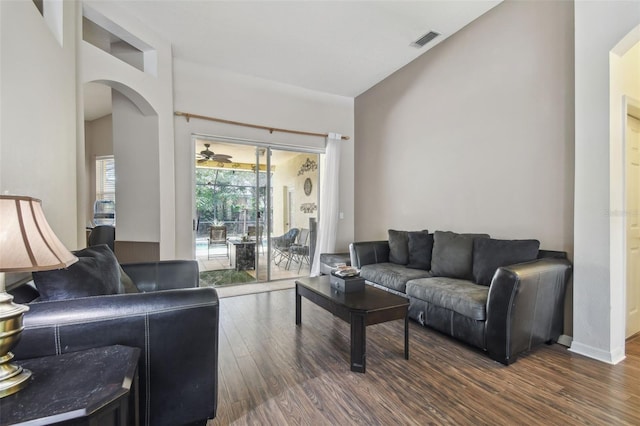6918 Potomac Cir, Riverview, FL 33578 - living room with arched walkways and dark wood-style flooring