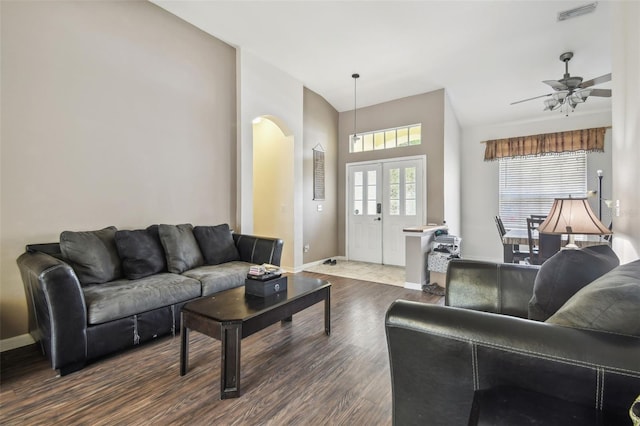 6918 Potomac Cir, Riverview, FL 33578 - living room featuring arched walkways, dark wood-style floors, baseboards, and ceiling fan