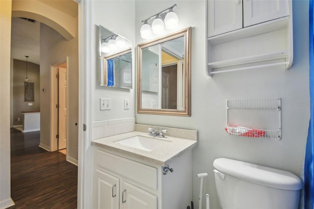 6918 Potomac Cir, Riverview, FL 33578 - half bath featuring toilet, wood finished floors, and vanity