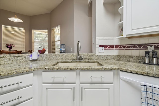 6918 Potomac Cir, Riverview, FL 33578 - kitchen with a sink, dishwasher, decorative backsplash, white cabinetry, and light stone counters