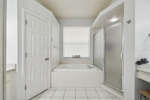 6918 Potomac Cir, Riverview, FL 33578 - bathroom with vanity, a shower stall, a garden tub, and tile patterned floors