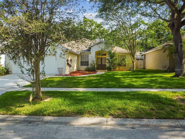 6918 Potomac Cir, Riverview, FL 33578 - single story home with an attached garage, concrete driveway, stucco siding, a front yard, and french doors