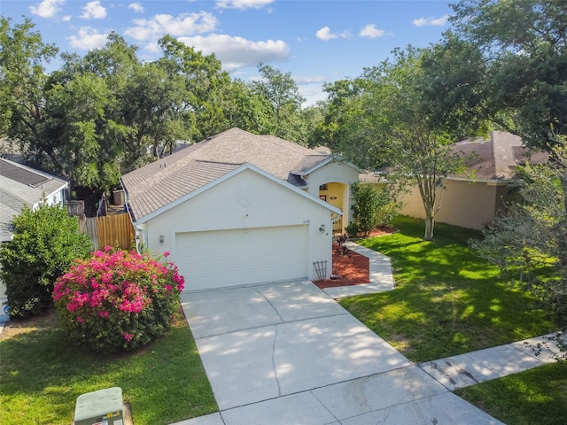 6918 Potomac Cir, Riverview, FL 33578 - ranch-style house with a front lawn, concrete driveway, stucco siding, and an attached garage