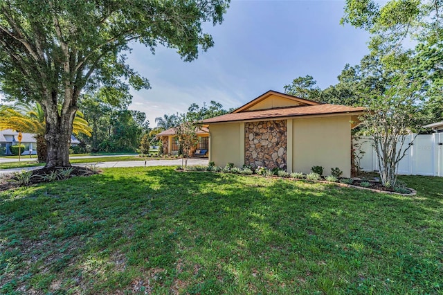 3041 Oak View Dr, Palm Harbor, FL 34684 - view of property exterior featuring stucco siding and stone siding