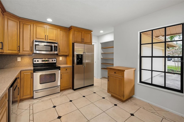 3041 Oak View Dr, Palm Harbor, FL 34684 - kitchen featuring stainless steel appliances, decorative backsplash, brown cabinetry, recessed lighting, and baseboards