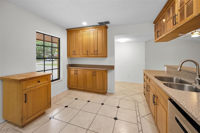 3041 Oak View Dr, Palm Harbor, FL 34684 - kitchen with a sink, dishwashing machine, glass insert cabinets, ceiling fan, and recessed lighting