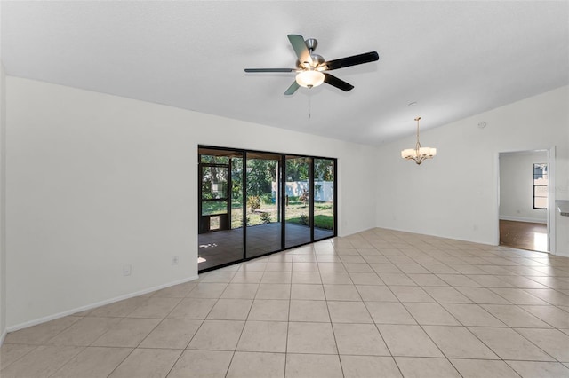 3041 Oak View Dr, Palm Harbor, FL 34684 - spare room featuring vaulted ceiling, a chandelier, a ceiling fan, healthy amount of natural light, and light tile patterned floors