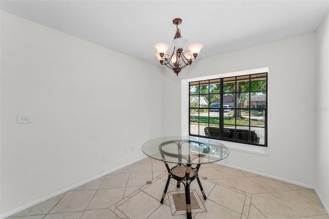 3041 Oak View Dr, Palm Harbor, FL 34684 - unfurnished dining area featuring a chandelier, light tile patterned floors, and baseboards