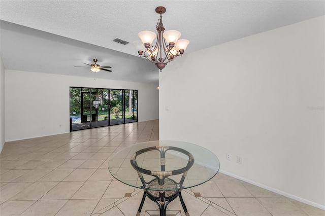 3041 Oak View Dr, Palm Harbor, FL 34684 - spare room featuring light tile patterned flooring, a chandelier, ceiling fan, a textured ceiling, and baseboards