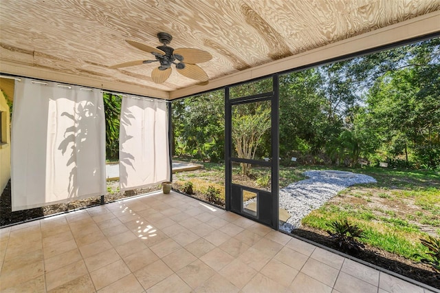 3041 Oak View Dr, Palm Harbor, FL 34684 - unfurnished sunroom with a ceiling fan and view of scattered trees