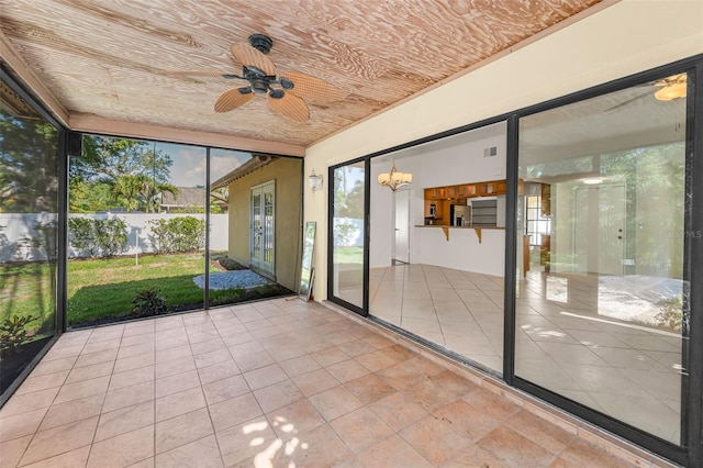 3041 Oak View Dr, Palm Harbor, FL 34684 - unfurnished sunroom with a ceiling fan