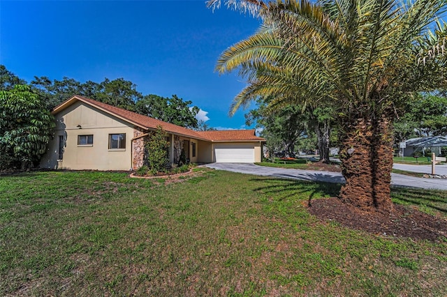 3041 Oak View Dr, Palm Harbor, FL 34684 - ranch-style house featuring a garage, a front yard, driveway, and stucco siding