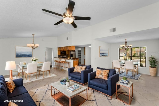 3041 Oak View Dr, Palm Harbor, FL 34684 - living room with a chandelier, light tile patterned floors, ceiling fan, and vaulted ceiling