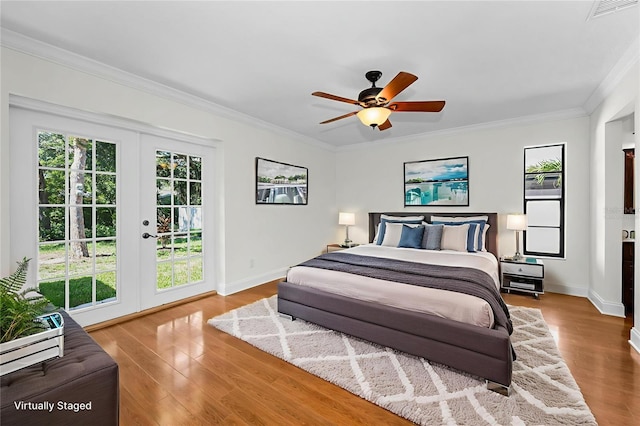 3041 Oak View Dr, Palm Harbor, FL 34684 - bedroom featuring french doors, crown molding, wood finished floors, access to outside, and a ceiling fan