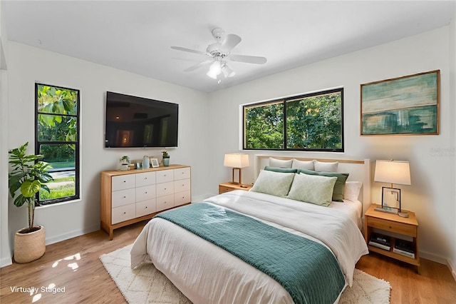 3041 Oak View Dr, Palm Harbor, FL 34684 - bedroom featuring light wood-style flooring and a ceiling fan