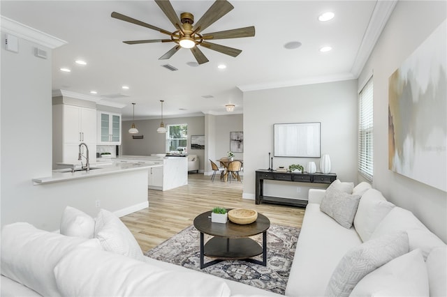 8518 Tidal Bay Ln, Tampa, FL 33635 - living room with ornamental molding, light wood-type flooring, a ceiling fan, recessed lighting, and baseboards