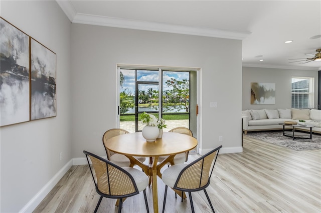 8518 Tidal Bay Ln, Tampa, FL 33635 - dining space with ornamental molding, light wood-type flooring, baseboards, a ceiling fan, and recessed lighting