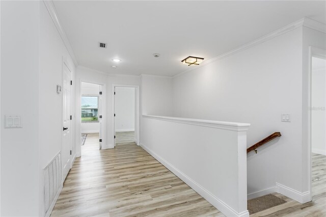 8518 Tidal Bay Ln, Tampa, FL 33635 - corridor with an upstairs landing, light wood finished floors, ornamental molding, and baseboards