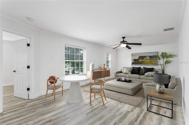 8518 Tidal Bay Ln, Tampa, FL 33635 - living room with light wood-style floors, ornamental molding, a ceiling fan, and baseboards