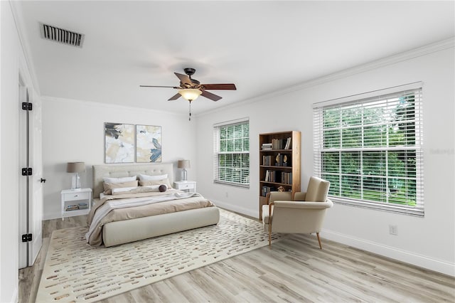 8518 Tidal Bay Ln, Tampa, FL 33635 - bedroom with crown molding, light wood-type flooring, baseboards, and ceiling fan