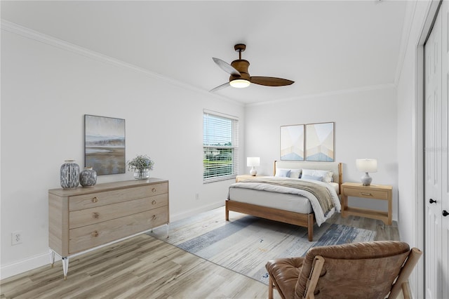 8518 Tidal Bay Ln, Tampa, FL 33635 - bedroom featuring light wood-style flooring, baseboards, ornamental molding, a closet, and a ceiling fan