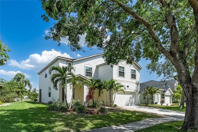 8518 Tidal Bay Ln, Tampa, FL 33635 - view of front of home featuring driveway, stucco siding, an attached garage, and a front lawn