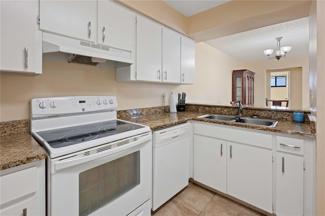 8436 60th St N Unit 304, Pinellas Park, FL 33781 - kitchen featuring white appliances, under cabinet range hood, a sink, a chandelier, and white cabinetry